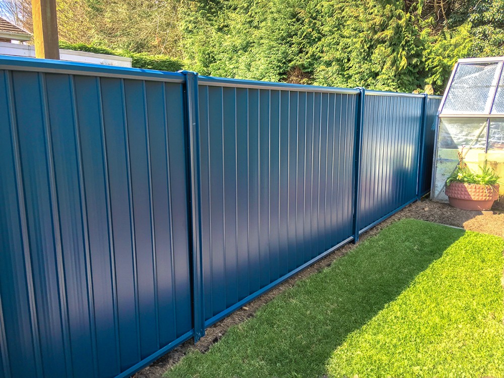 Blue fence in garden area
